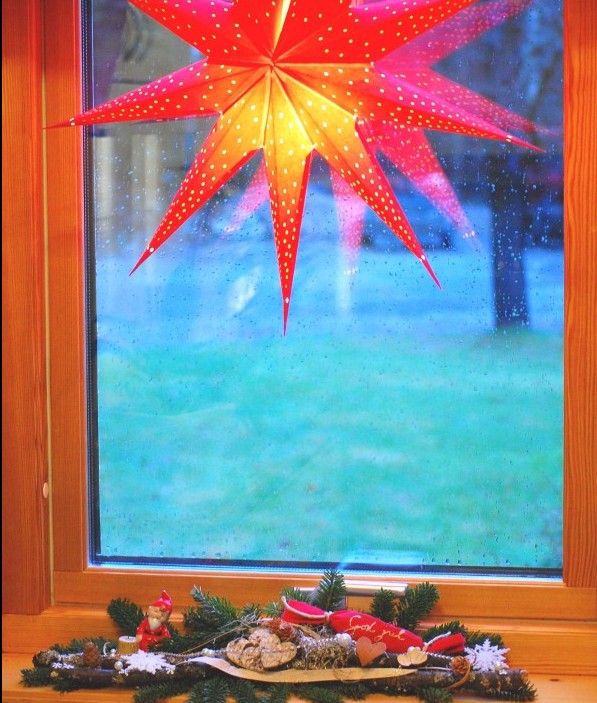 Stjärna med fönsterdekoration av grenar